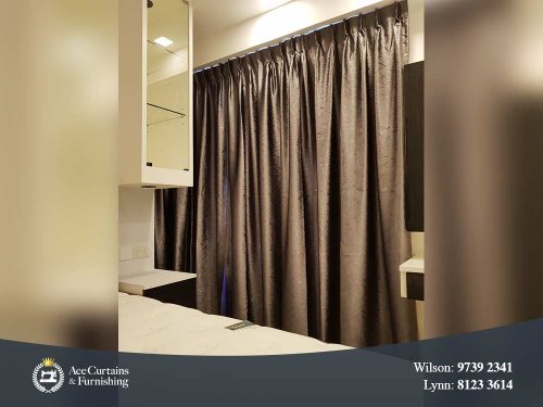 Brown satin dimout curtains acting as a room partition and separator.