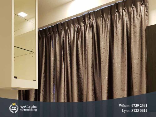 Closeup of satin pattern and pleated curtain.