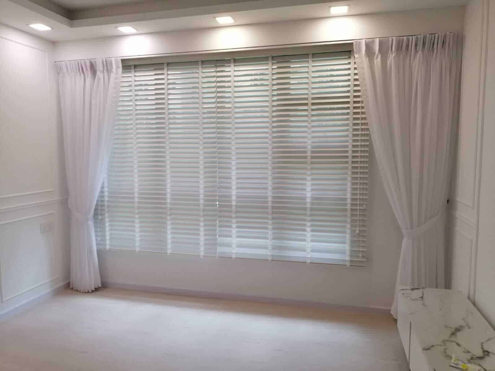 Layering Venetian blinds with day curtains for a themed HDB flat